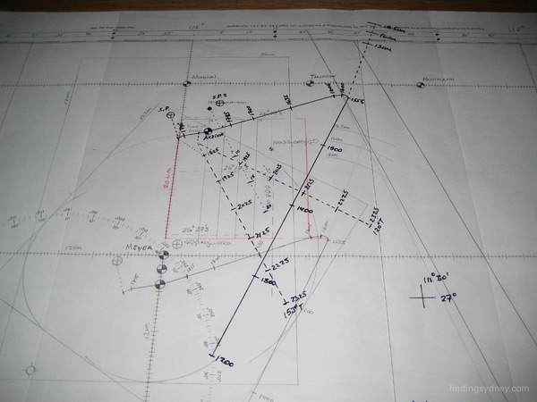 A transparent overlay of ship tracks being moved over a navigational chart to assess different scenarios.