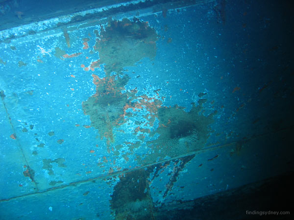A cluster of four 5.9-inch shell hits on the starboard side of HMAS Sydney, demonstrating precise gunnery.