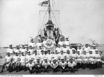 Alexandria, Egypt (?). c.1940-07. Group portrait of some of the crew members aboard HMAS Sydney II possibly following their successful action against the Italian cruiser Bartolomeo Colleoni off Cape Spada, Crete, on 19 July 1940. The Sydney was ultimately sunk off Carnarvon, WA, on 19 November 1941 following a fierce battle with the German raider Kormoran, which also sank. All 645 crew members aboard the HMAS Sydney were lost. (Original print held in AWM Archive Store) (Donor N. Scott)