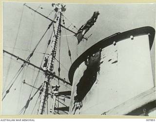THE HOLE IN THE FORWARD FUNNEL OF THE CRUISER HMAS SYDNEY (II) MADE BY A SHELL FIRED FROM THE ITALIAN CRUISER BARTOLOMEO COLLEONI IN ACTION OFF CAPE SPADA, CRETE.