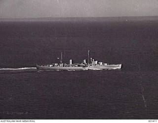 1939-07-17. AERIAL STARBOARD SIDE VIEW OF THE CRUISER HMAS SYDNEY (II) (EX HMS PHAETON). NOTE THE SINGLE 4 INCH AA GUNS AMIDSHIPS, WHICH DISTINGUISHED THE SYDNEY FROM HER TWO SISTERS HOBART AND PERTH. (NAVAL HISTORICAL COLLECTION)