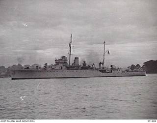 SYDNEY, NSW. C.1940. PORT BROADSIDE VIEW OF THE SLOOP HMAS WARREGO (II) AS COMPLETED. SHE IS ARMED WITH 4 INCH MARK XVI GUNS IN A TWIN MARK XIX MOUNTING FORWARD IN A POSITION AND A SINGLE MARK XX MOUNTING AFT IN X POSITION. THEY ARE CONTROLLED BY THE HIGH ANGLE CONTROL SYSTEM SITED BEHIND THE BRIDGE. A QUADRUPLE .5 INCH VICKERS AA MACHINE GUN IS FITTED IN B POSITION. NOTE THE KITE/OTTERS AND FLOATS OF THE OROPESA MINESWEEPING GEAR AND THE DEPTH CHARGES ON THROWERS AND IN TRAPS AFT. (NAVAL HISTORICAL COLLECTION)