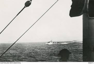 BRITISH DESTROYERS OF THE MEDITERRANEAN FLEET AT SEA, SEEN FROM THE CRUISER HMAS SYDNEY (II). THIS PHOTOGRAPH WAS PROBABLY TAKEN DURING THE CHASE OF THE ITALIAN CRUISER GIOVANNI DELLE BANDE NERE, THE LAST STAGE OF THE ACTION OFF CAPE SPADA. IF SO THE DESTROYERS ARE HMS HERO AND HASTY. (NAVAL HISTORICAL COLLECTION).