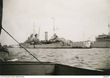 ALEXANDRIA, EGYPT. 1940-07-21. THE CRUISER HMAS SYDNEY (II) AT HER MOORINGS. IN THE BACKGROUND ON THE RIGHT IS THE SUBMARINE DEPOT SHIP HMS MEDWAY AND ON THE LEFT THE HOSPITAL SHIP MAINE. SYDNEY IS REPAIRING DAMAGE TO HER FUNNEL SUSTAINED IN THE SUCCESSFUL ACTION OFF CAPE SPADA WITH THE ITALIAN CRUISERS BARTOLOMEO COLLEONI AND GIOVANNI DELLE BANDE NERE. (NAVAL HISTORICAL COLLECTION).