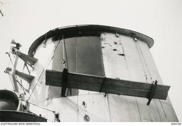 ALEXANDRIA, EGYPT. 1940-07-24. TWO NEW PLATES USED TO REPAIR THE HOLE IN THE FORWARD FUNNEL OF THE CRUISER HMAS SYDNEY (II) MADE BY 6 INCH SHELL FROM THE ITALIAN CRUISER BARTOLOMEO COLLEONI DURING THE ACTION OFF CAPE SPADA, CRETE. (NAVAL HISTORICAL COLLECTION).
