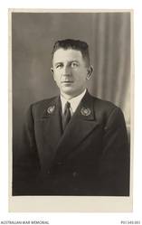 Studio portrait of 10950 Chief Petty Officer Robert (Mick) Triggs, RAN. Master at Arms Triggs died at sea when HMAS Sydney II was sunk in the Indian Ocean by the German auxiliary cruiser Kormoran on 20 November 1941.