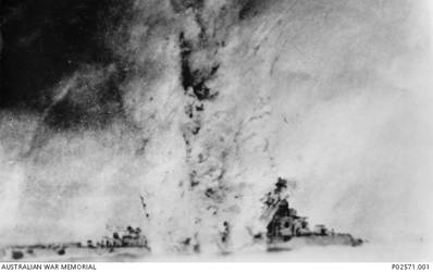 The Italian light cruiser, Bartolomeo Colleoni explodes after a direct hit amidships from a British torpedo. On 17 July 1940 the cruiser and her sister ship, Bande Nere, sailed from Tripoli, North Africa, bound for Leros in the Aegean, where British activities in Greece were causing concern for the Italian navy. On 18 July 1940 the Italian ships were spotted by British aircraft and in the early hours of 19 July, while off Cape Spada, Crete, the Italian squadron, was intercepted by the Australian light cruiser HMAS Sydney II, and five destroyers including HMS Havock. During the ensuing engagement the Bartolomeo Colleoni was damaged by a shell hit in the engine room which immobilised her leaving her an easy target for torpedo attack by the Royal Navy destroyers. She sank with the loss of 121 sailors and the 550 survivors were rescued by British destroyers. .