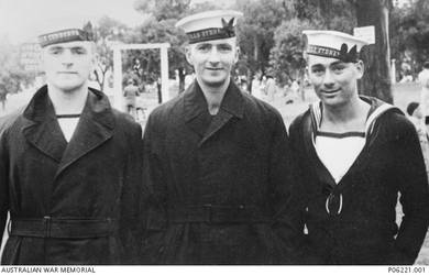 Informal outdoor portrait, taken in Wattle Park, of, left to right, W1847 Stoker Second Class (Sto II) Robert Aubrey Fry, HMAS Cerberus, of Burwood, Vic; 22816 Stoker (Sto) William Albert Fry, HMAS Sydney, of Cabarita, NSW; and 23011 Sto Philip (Roy) Staveley, HMAS Sydney, of Fremantle, WA. They are seen in Wattle Park after the arrival from the Mediterranean of Sto William Fry and Sto Staveley on HMAS Sydney [II]. Sto II Robert Fry joined the crew of HMAS Sydney on 26 March 1941 and was killed in action on 20 November 1941, when HMAS Sydney was sunk off the coast of Western Australia by the German raider Kormoran. Sto William Fry transferred from HMAS Sydney to HMAS Cerberus and then HMAS Brisbane, before being discharged on medical grounds on 20 July 1944. Sto Staveley transferred to HMAS Leeuwin on 31 October 1941 and was discharged from the Navy on 30 March 1951.