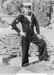 Outdoor portrait of 22850 Leading Stoker (Ldg Sto), Herbert Frederick Herrod, HMAS Sydney II, of Waverley, NSW. Ldg Sto Herrod enlisted on 7 February 1939 and he was killed in action, aged 20, on 20 November 1941, when the Sydney II was sunk in the Indian Ocean off the coast of Western Australia by the German Auxiliary cruiser HSK Kormoran.