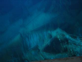 Damage to fwd end port side 4-inch gun deck