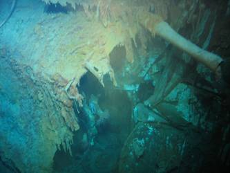 Looking into opening in forepart of hull. Note coil of rope.