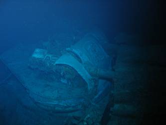 Damage to gun housing of A turret. Deck folded over barrels