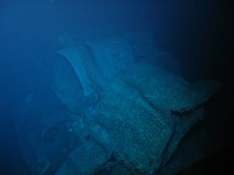 Damage to gun housing of A turret. Deck folded over barrels