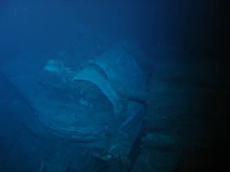 Damage to gun housing of A turret. Deck folded over barrels