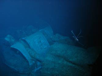 Fore deck folded back over barrels of A turret
