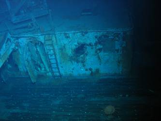 Damage to bakery on port side of ship, crane visible above