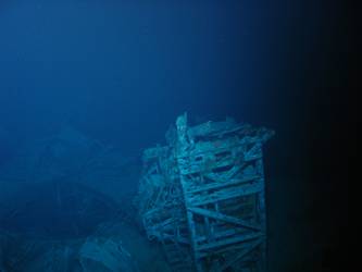 Rear of ship's aircraft crane, hole in deck where funnel torn away