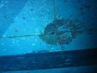 Shell hit on port side of ship