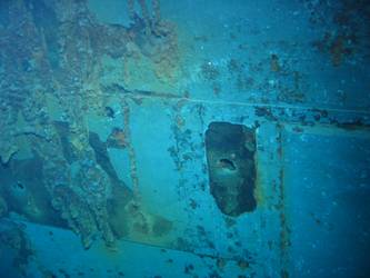 Shell hit on port side of ship