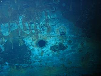 Shell hit on port side of ship below quaterdeck