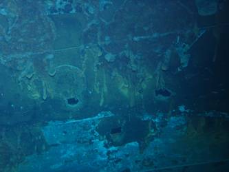 Shell hit on port side of ship