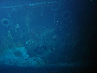 Shell hit on port side of ship