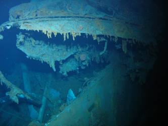Top of forward funnel drapped over Y turrent viewed from stbd side