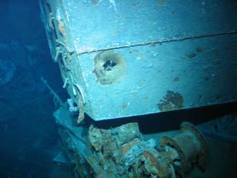 Shell hit on right hand side of X turret gun house