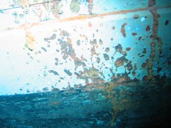 Shell hit above boot topping on stbd side below 4-inch gun deck