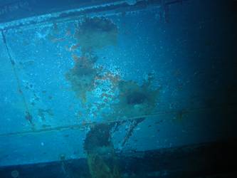 Shell hits on ships stbd side below  torpedo tube mount