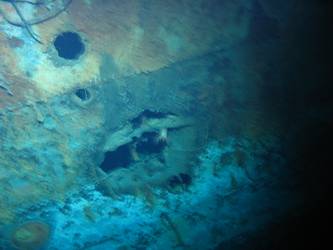 Hole in ship's side in vicinity of forward superstructure