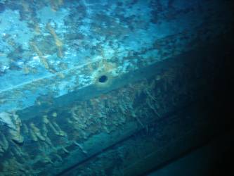 Hole in ship's side in vicinity of forward superstructure
