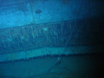 Ship's bent stbd bilge keel resting on bottom