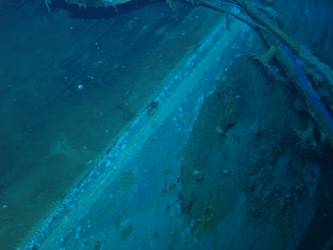 Close-up of shell hit on stb side of ship