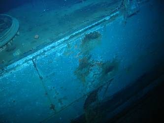 Shell hits on ship side beneath mount for stbd torpedo tubes