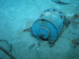 Unidentified cylindrical drum on seabed