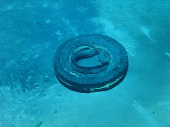 Tyre with white band around tread pattern - possibly from aircraft?