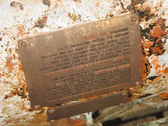 Brass tally plate on side of quadruple torpedo mount