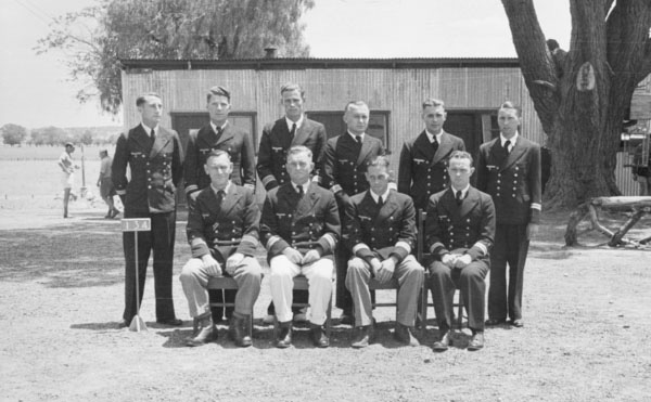 Kormoran Officers 10 German naval officers in uniform, 6 standing behind, 4 seated infront, in an Australian POW camp.